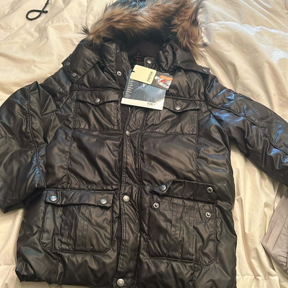 Geox 10 years size jacket never worn dark brown black.